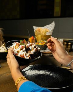 A vibrant display of Indian street food with spicy chaat, showcasing rich flavors and textures.